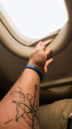 frankfurt am main left person's arm with compass tattoo germany